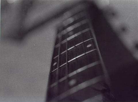 fretboard of my eko acoustic. camera - pentax mx. film - ilford hp5 plus